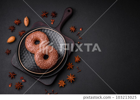 Delicious chocolate glazed donut sprinkled with chocolate chips 103213025