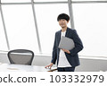 Portrait of young businessman with laptop 103332979