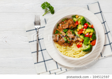 beef mushrooms stew with mashed potato and salad 104512597