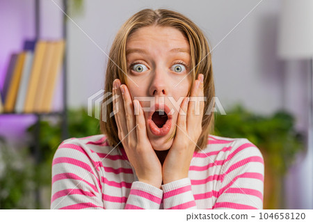 Excited happy woman surprised, shocked by sudden victory, good win news, celebrating, wow reaction 104658120