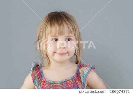 Pretty little girl with brown hair portrait 106074571