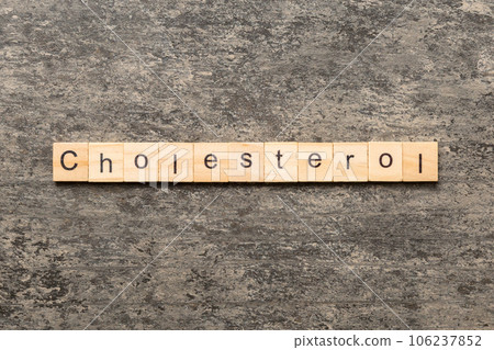 cholesterol word written on wood block. cholesterol text on table, concept 106237852