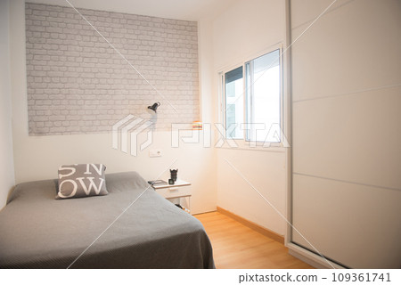 bedroom with its bed in a home 109361741