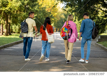 Group of students walking in the park and looking excited 109835397