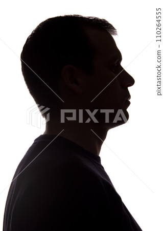 Portrait of a young man, side view - dark isolated silhouette 110264555