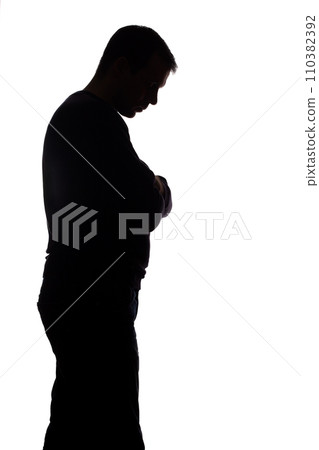 Portrait of a young man, side view - dark isolated silhouette 110382392