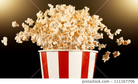 Popcorn Flying up in the Air from Paper Bucket. 111167706