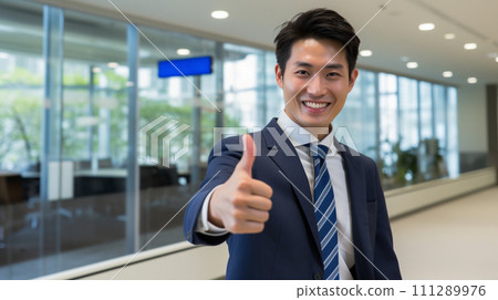 A businessman who makes a thumb 111289976