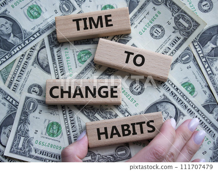 Time to Change Habits symbol. Wooden blocks with words Time to Change Habits. Beautiful dollar background. Psychologist hand. Psychology and Time to Change Habits concept. Copy space. 111707479