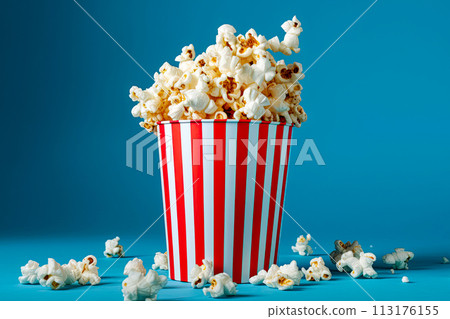 Popcorn in traditional red and white bucket on blue background. Generative Ai 113176155