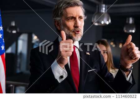 American politician at press conference after campaign speech 113460022