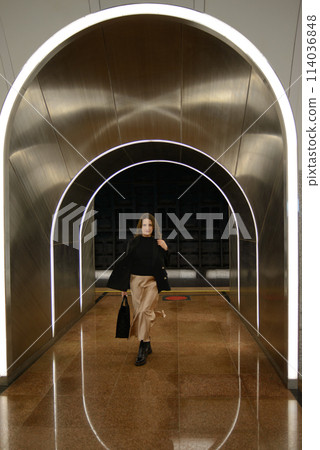 Beautiful lonely girl in black posing in the subway. 114036848