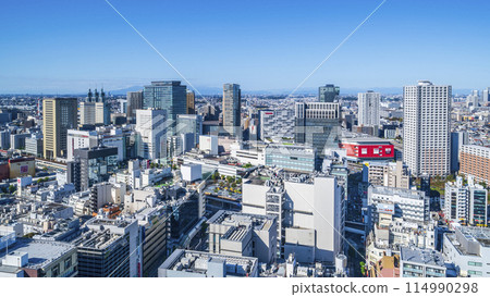 Kawasaki cityscape: Streets in front of Kawasaki Station under the clear blue sky [Kawasaki City, Kanagawa Prefecture] 114990298