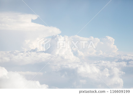 Sunrise above textured clouds from airplane window 116609199