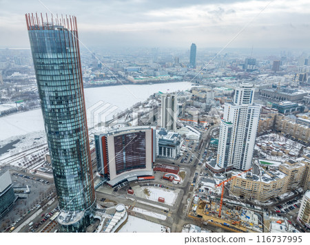 Yekaterinburg aerial panoramic view in Winter at sunset. Yekaterinburg city and pond in winter. 116737995