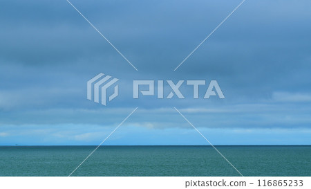 Storm Freight Dark Gloomy Rain Clouds Over A Calm Sea. Dramatic Sea Landscape With Moody Sky. Still. 116865233