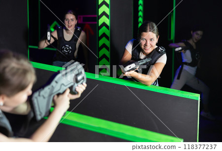 Girls play laser tag, jokingly fight with light weapons 118377237