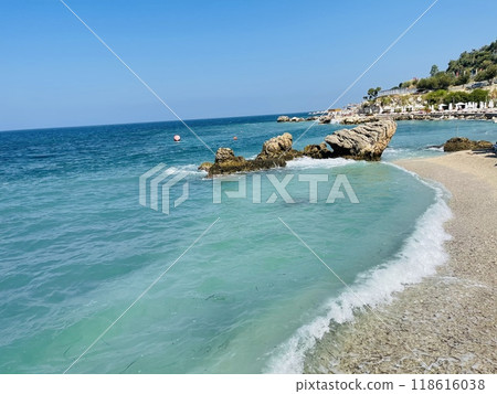 Rocky beach and crystal turquoise water of Ionian Sea in Albania. 118616038