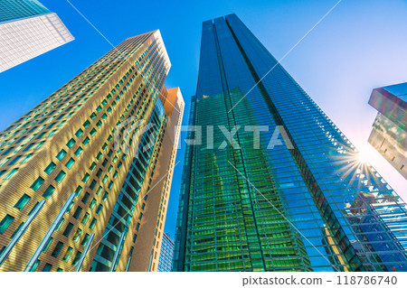 Tokyo cityscape, Japan, September. Shiodome office district. View of Shiodome City Center reflected in Nippon Television Tower. 118786740