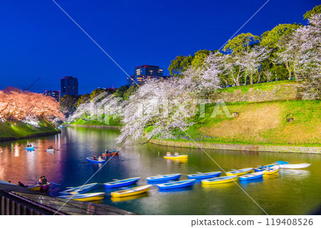 Two colors compete in the Tokyo cityscape of Japan...Chidorigafuchi where the cherry blossoms are in full bloom. View of illuminated cherry blossoms and more...=April 7th 119408526