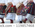 Vlach Traditional Folk Clothing with Embroidered Skirts and Floral Motifs 119857468