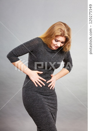 Woman having strong stomach ache. Syndroms 120275549