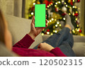 Person holding smartphone with green screen 120502315