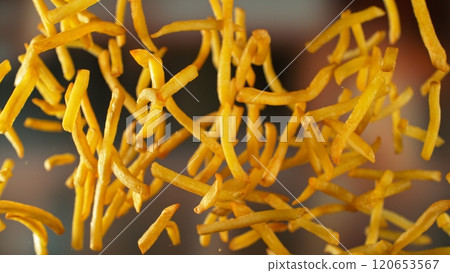 Freeze motion of flying french fries on gradient background 120653567