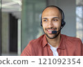 A professional customer service representative wearing a headset provides excellent support with a positive attitude. Capturing the essence of communication and teamwork in office settings. 121092354