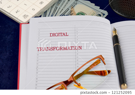 Big data and networking concept. DIGITAL TRANSFORMATION written in a business notebook, a conceptual photo 121252095