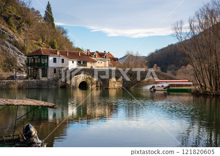 Arched bridge over Crnojevic river in small town near Skadar lake in Montenegro in winter time 121820605