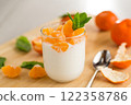 Refreshing dessert with tangerines and yogurt 122358786