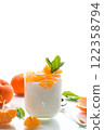 Creamy yogurt with tangerine slices, isolated on white background 122358794