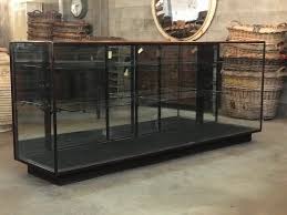 Each of the museum style display cases includes a clear acrylic dust cover that creates a protects objects from being touched. Glass Front Display Cabinet In Sold Vitrine