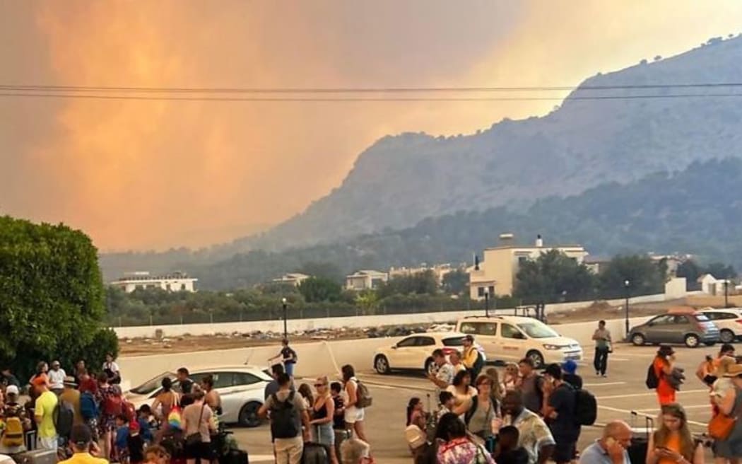 Greece fires: Thousands flee homes and hotels on Rhodes as fires spread