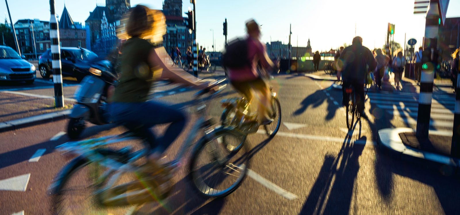 Crowded city street cyclists and pedestrians