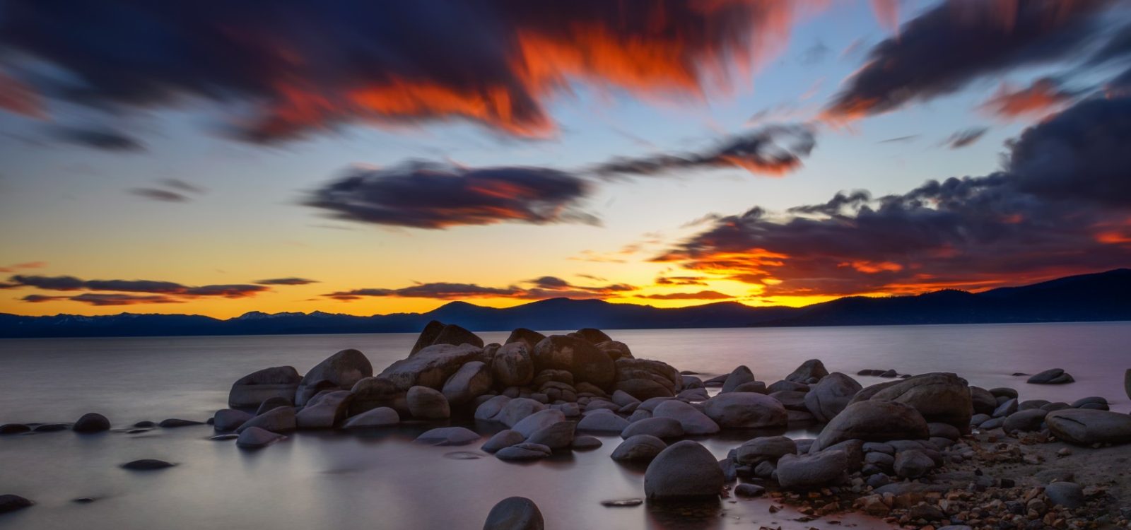 seaside sunset from a rocky beach