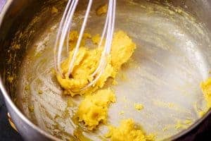 Whisking the milk into the flour mixture