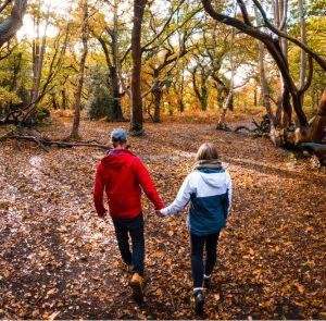 Couple walking through the forest on the Isle of Wight