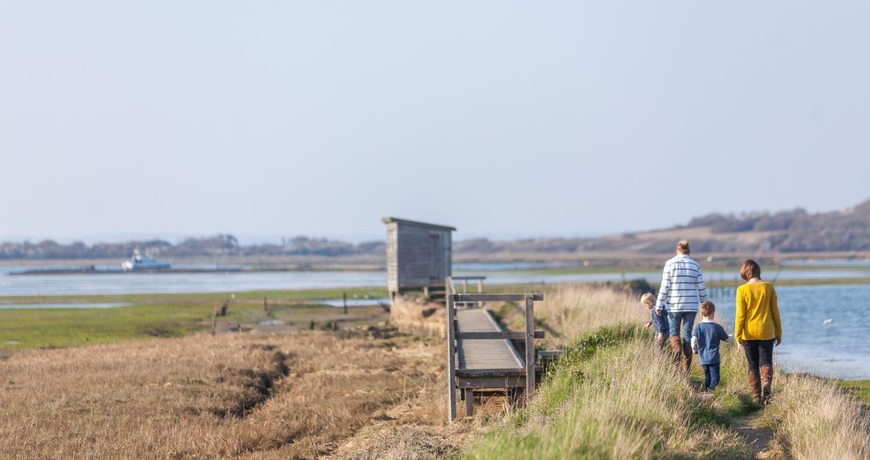 Family walking at Newtown National Nature Reserve, National Trust, Isle of Wight