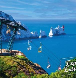 View of the Needles in the background with people on the chairlift, The Needles Landmark Attraction, Isle of Wight, Things to Do