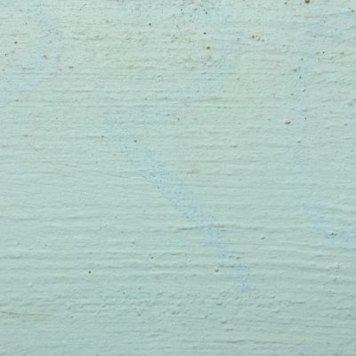 Concrete wall with teal paint featuring great texture