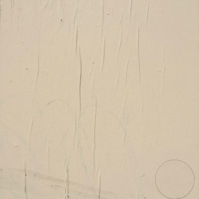 Coat of off white paint on wall with wrinkled paper