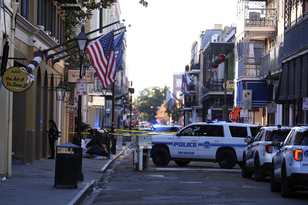 Emergency service vehicles form a security barrier.