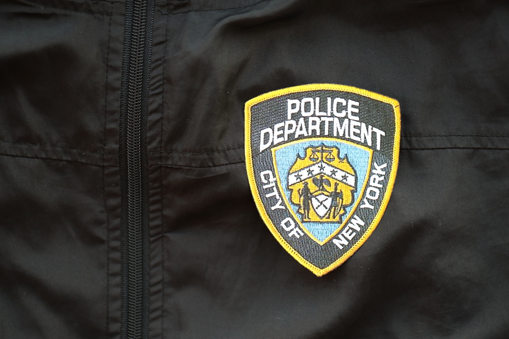 NYPD patch on shoulder.