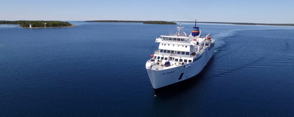 Wide angle shot of the Chi-Cheemaun with Manitoulin Island in the background