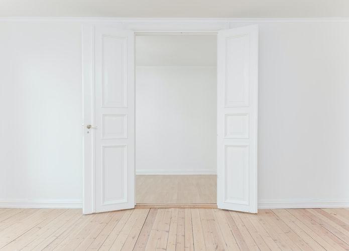 White door with white walls.