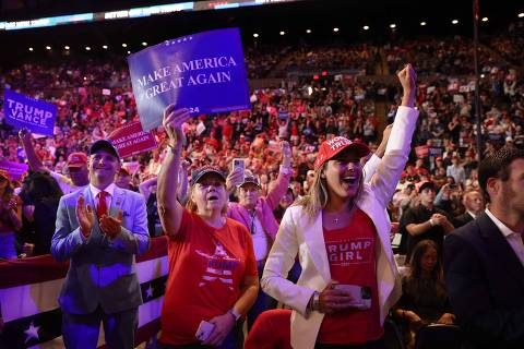 UNIONDALE, NEW YORK - SEPTEMBER 18: Supporters watch and cheer as Republican presidential nominee, former U.S. President Donald Trump speaks at an evening rally in Uniondale on Long Island on September 18, 2024 in Uniondale, New York. Security at the event is tight following the arrest of an individual over the weekend hiding with a gun at Trumps Florida golf course.   Spencer Platt/Getty Images/AFP (Photo by SPENCER PLATT / GETTY IMAGES NORTH AMERICA / Getty Images via AFP)