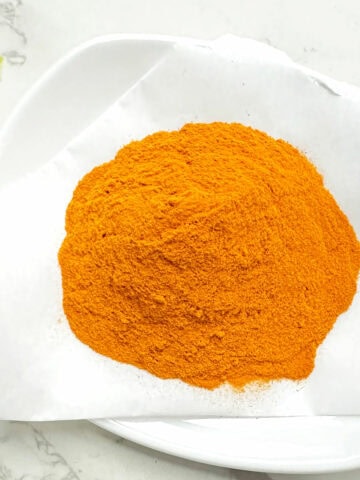 Turmeric powder in a plate.