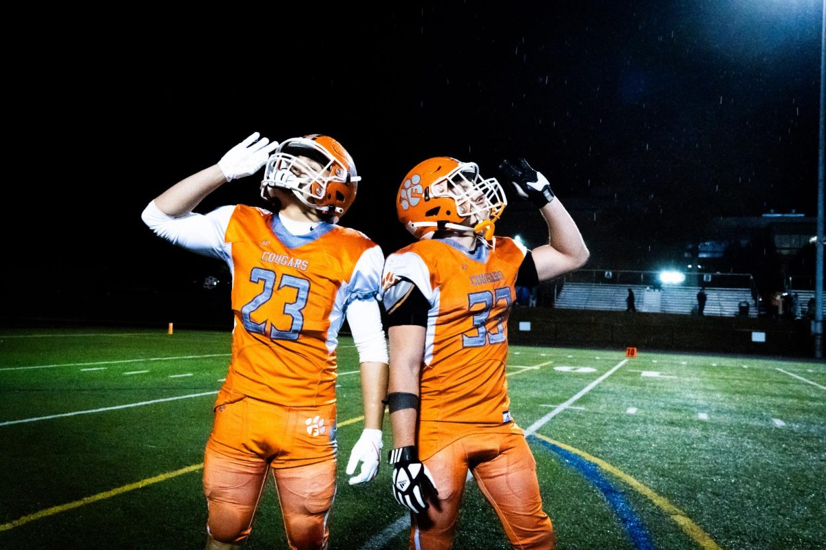 Seniors Ethan Wenger (Left) and Kael Morosko (Right) celebrate with each other after moving on to the third round of the playoffs with a win over Sparrows Point 38-0. Photo Courtesy of Joseph Mullen.